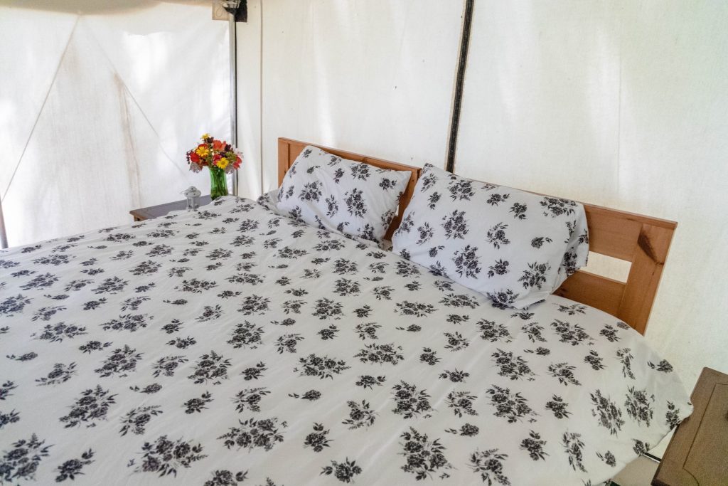 King-side Douglas mattress with fresh linens inside The Aboyne tent.